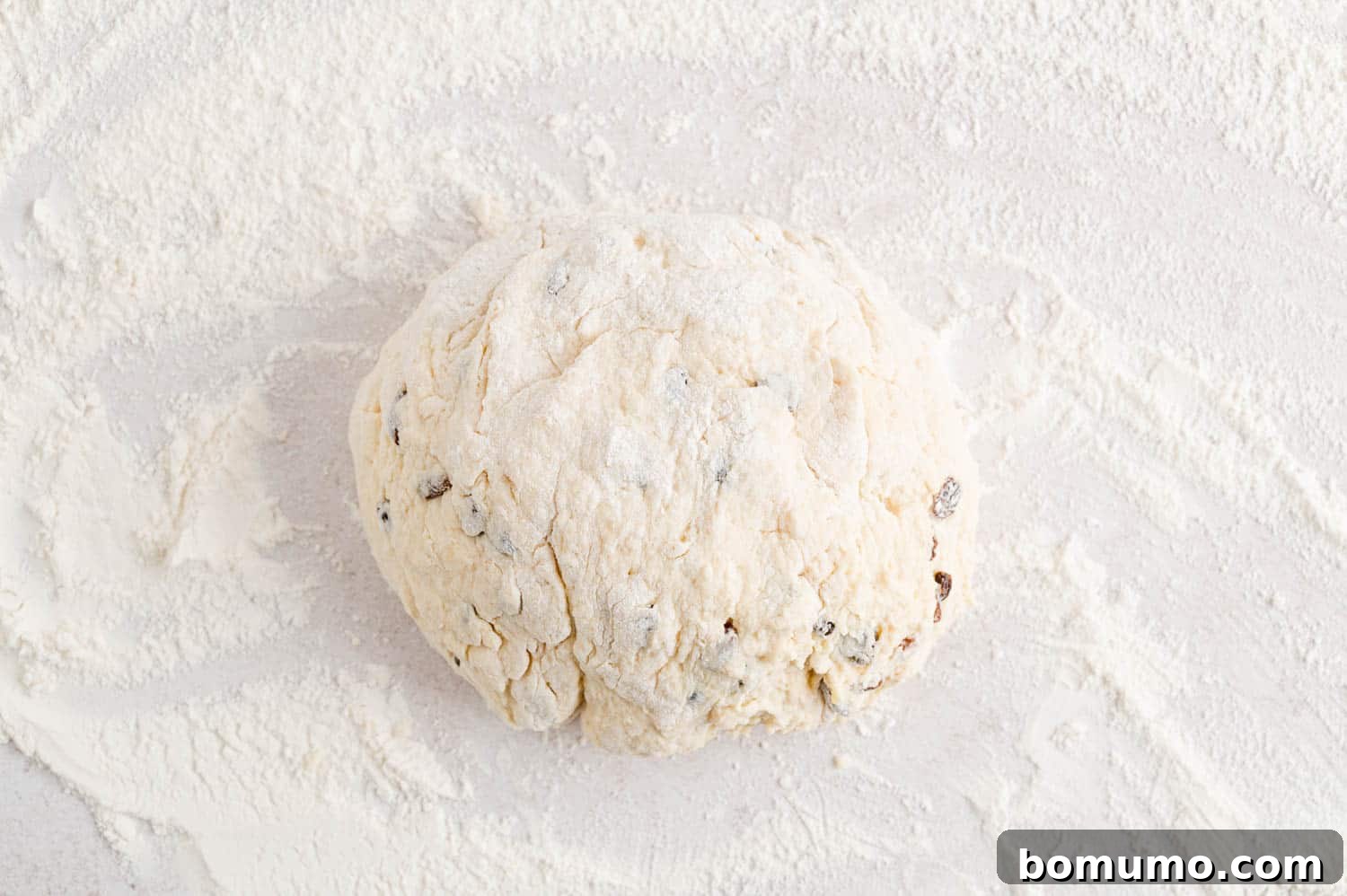 Irish soda bread dough formed into a round ball.