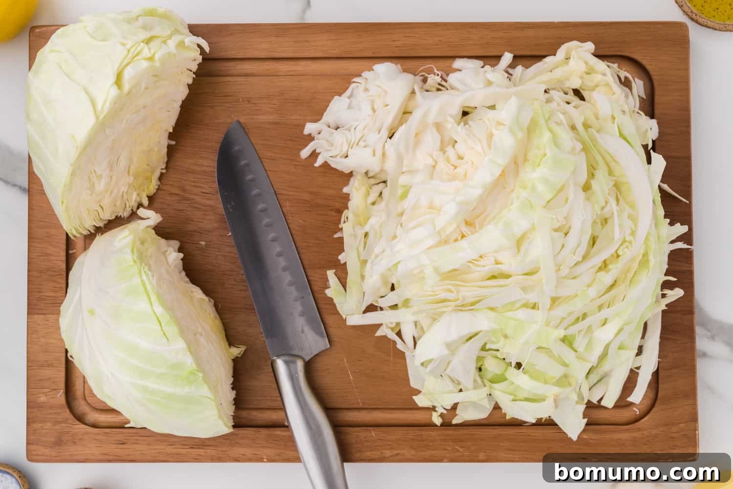 Sautéed Cabbage Reimagined 5 Cabbage being sliced.