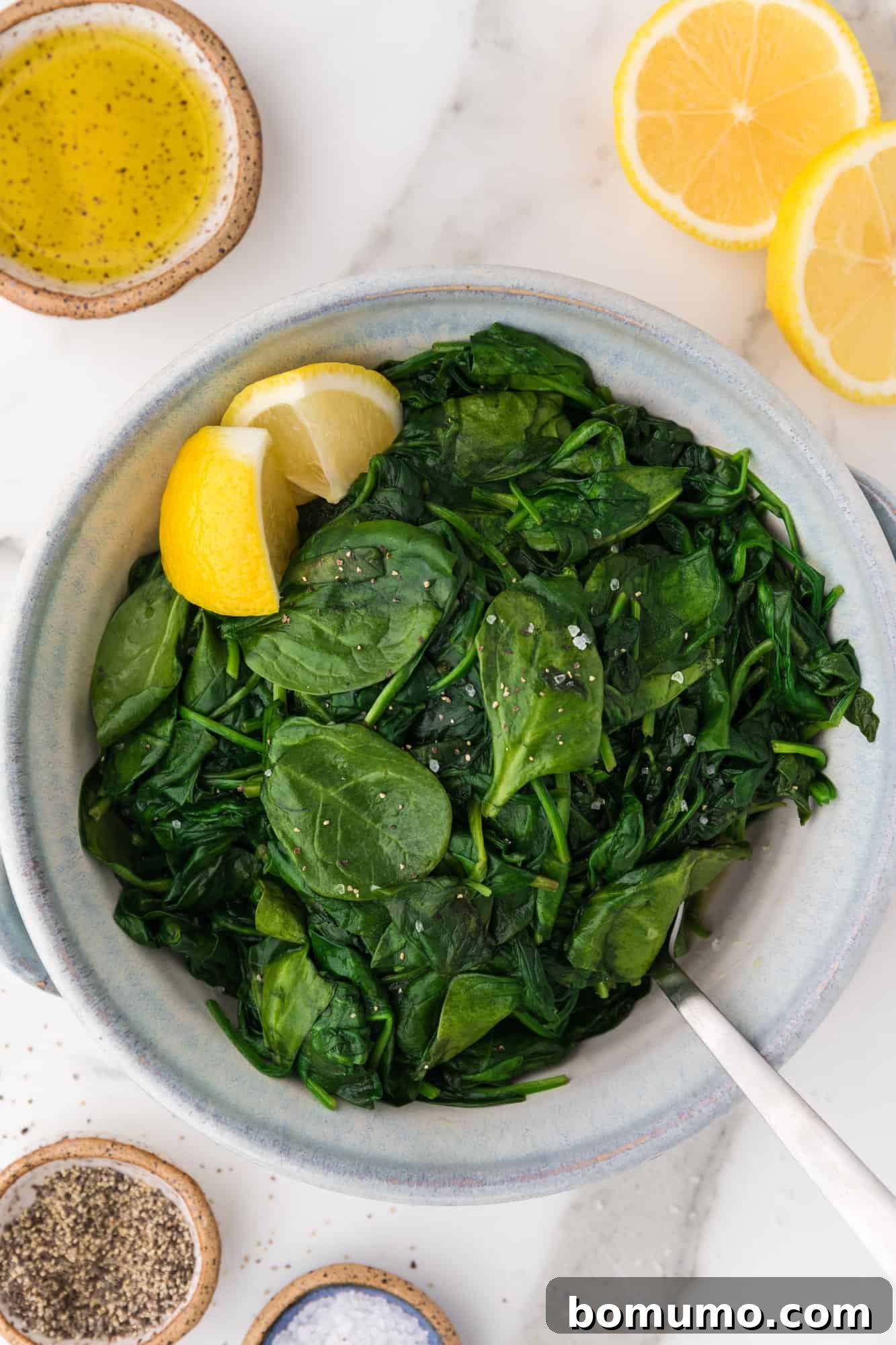 Pan-Seared Spinach Sensation 8 A serving of perfectly sautéed spinach in a pristine white bowl, garnished simply.