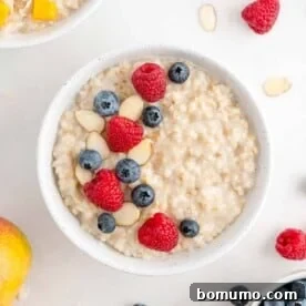 Crockpot oatmeal topped with raspberries, blueberries, almonds.