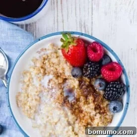 Image of instant pot steel cut oats topped with brown sugar, cinnamon, and fresh berries.