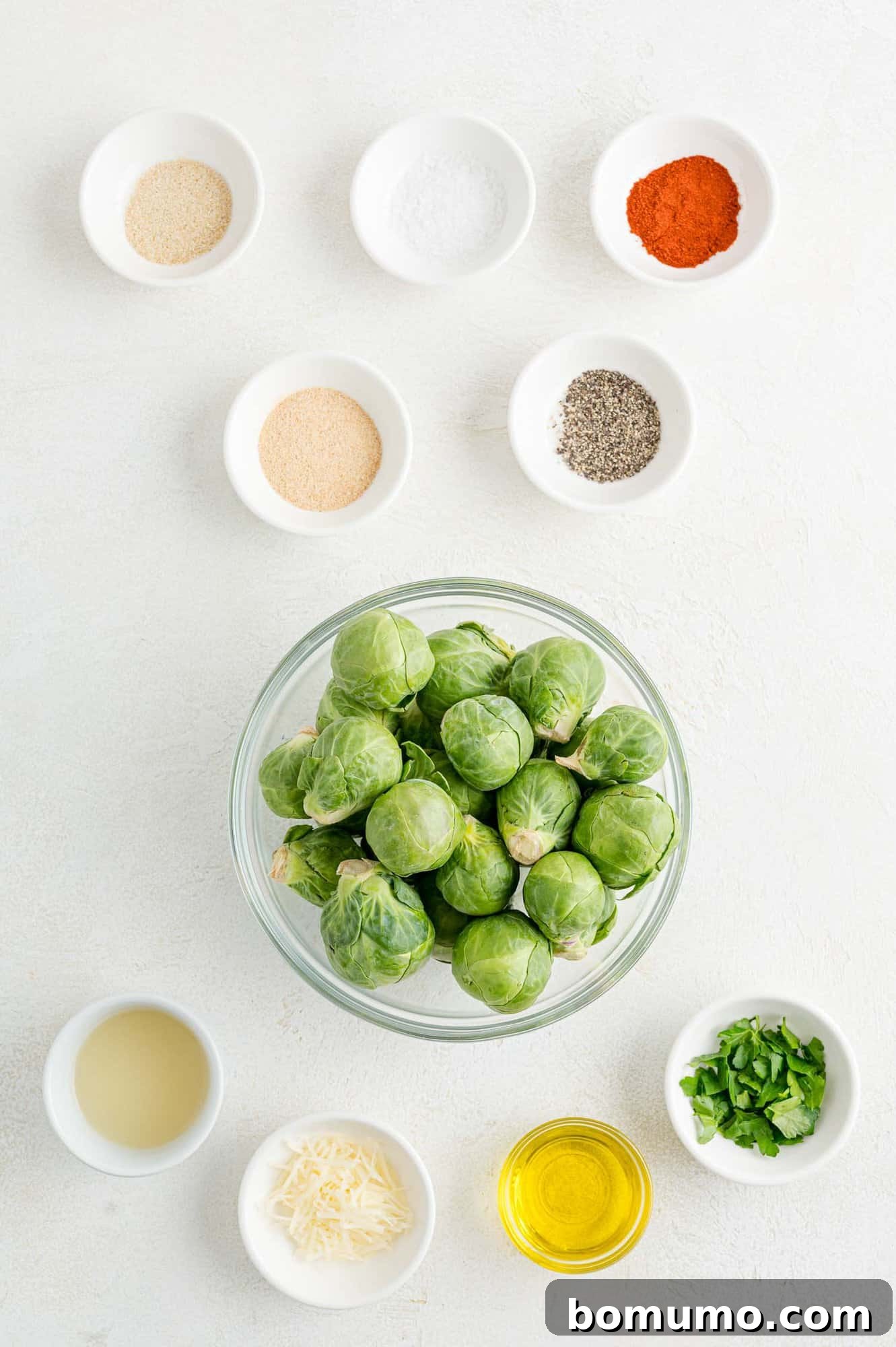 These are the best grilled Brussels sprouts! Cooked until golden and tossed in a combination of zesty lemon, parmesan, and fresh herbs. The ingredients for grilled Brussels sprouts.