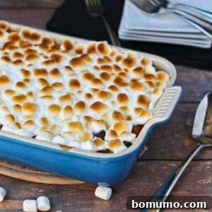Partial image of sweet potato bread pudding in blue baking dish