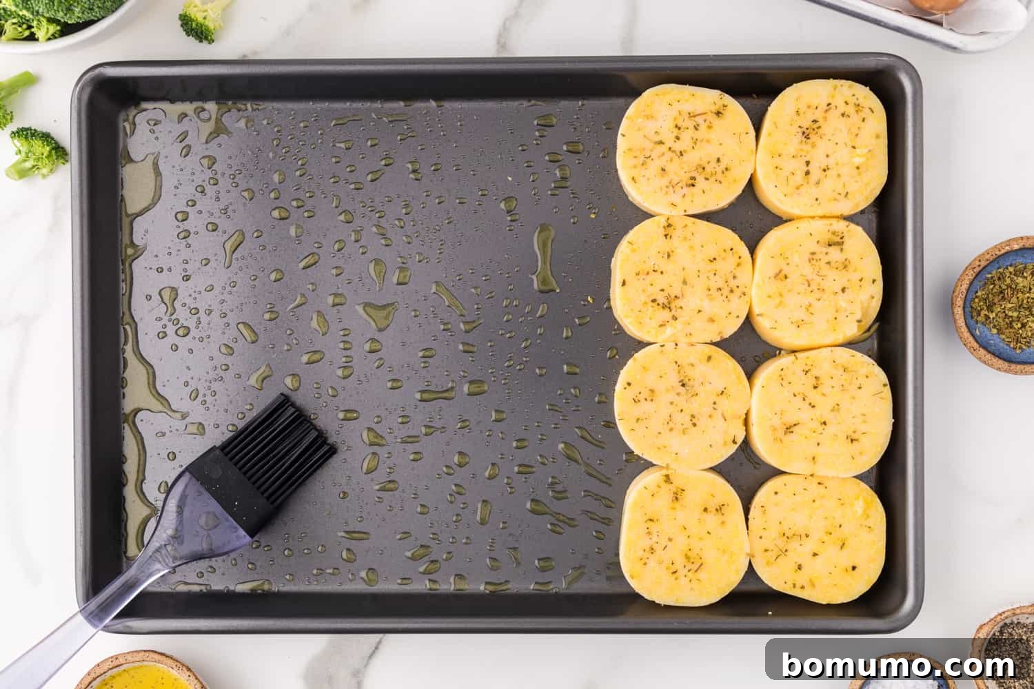 Sliced polenta on sheet pan.