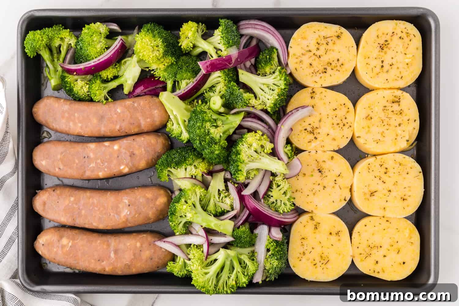 Broccoli and onions added to pan.