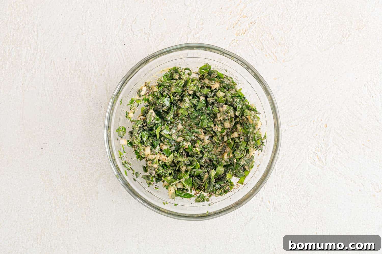 The herb mixture, now perfectly combined into a rich, aromatic paste, ready to be applied to the turkey breast.