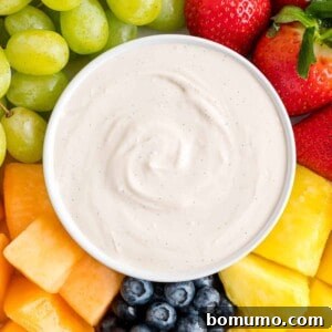 Cream cheese fruit dip surrounded by fresh fruit.