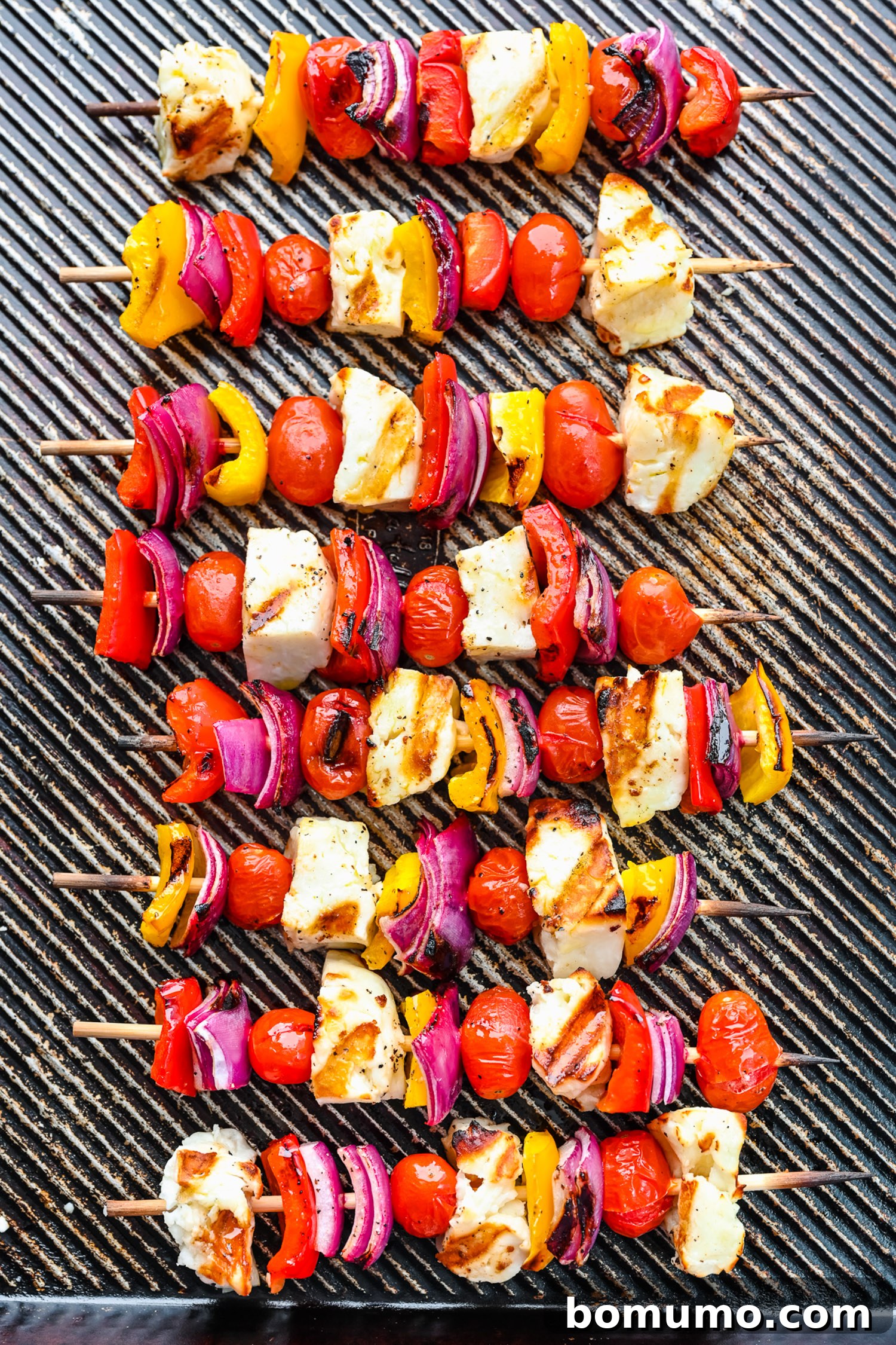 Grilled halloumi kebabs on a sheet pan.