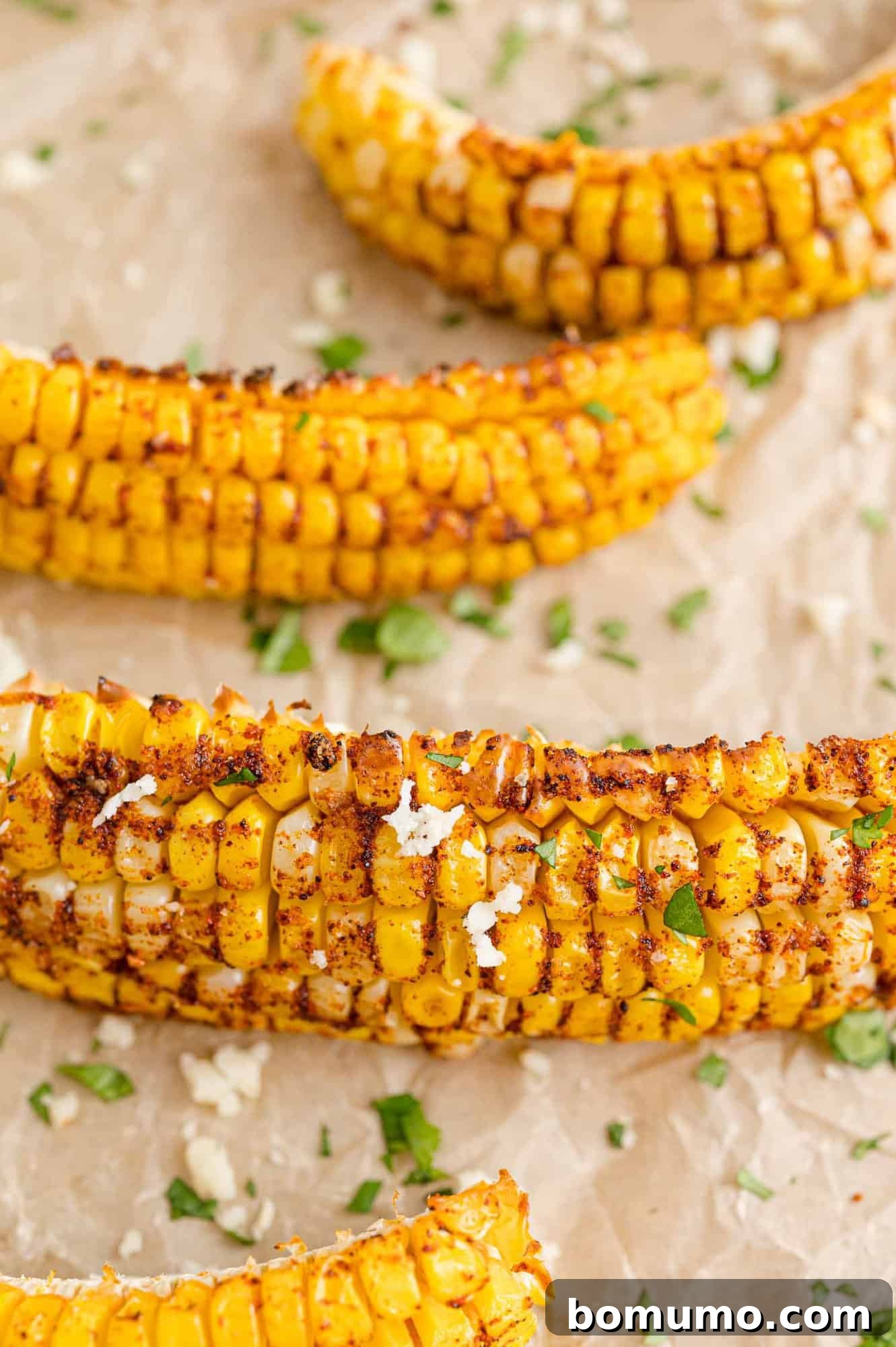 Baked corn ribs fresh from the oven, showing their golden color and distinct curl.