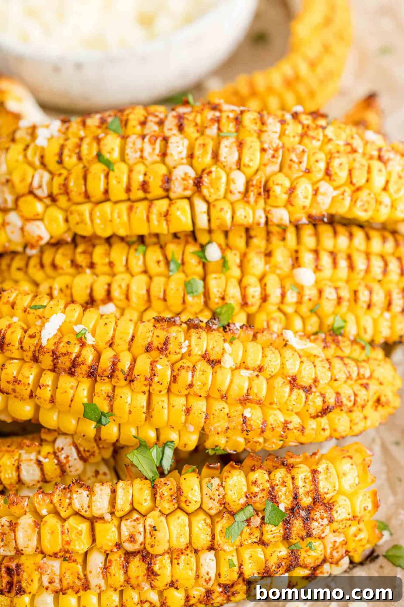 Seasoned corn ribs piled up on a serving platter, ready to be enjoyed.