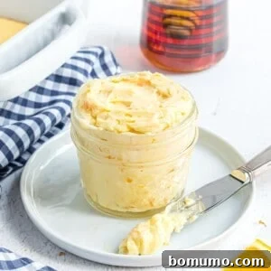 Orange honey butter in a small glass jar, ready for serving or gifting.