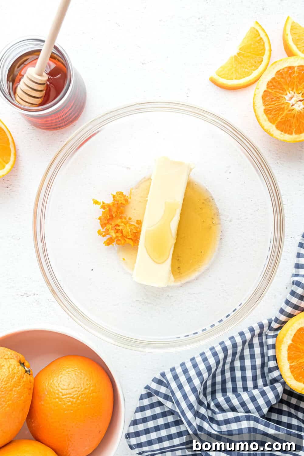 Bright orange zest finely grated and added to the honey and butter mixture, introducing a burst of citrus aroma.