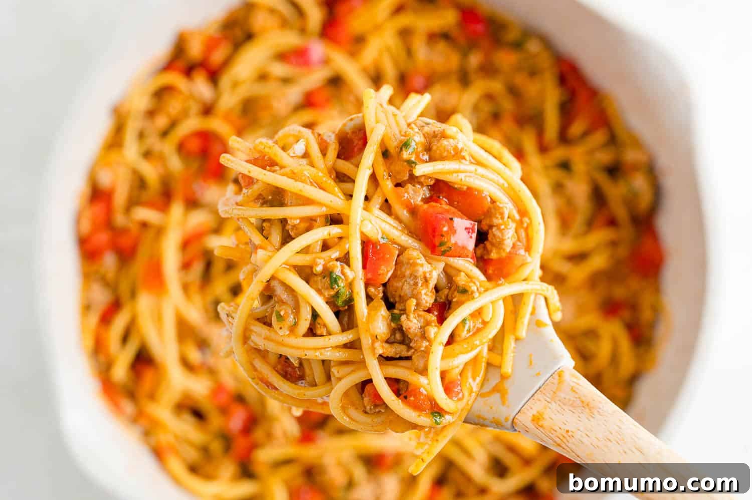 All ingredients cooked and mixed together, shown on a serving spoon.