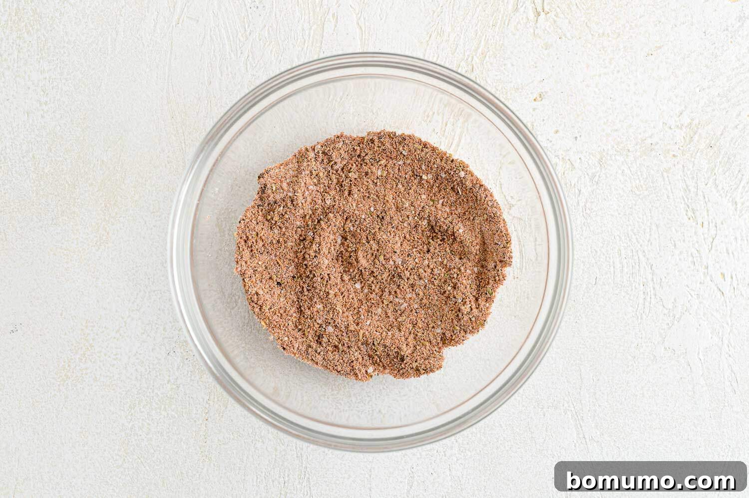 Spices and flour in a small bowl, combined.