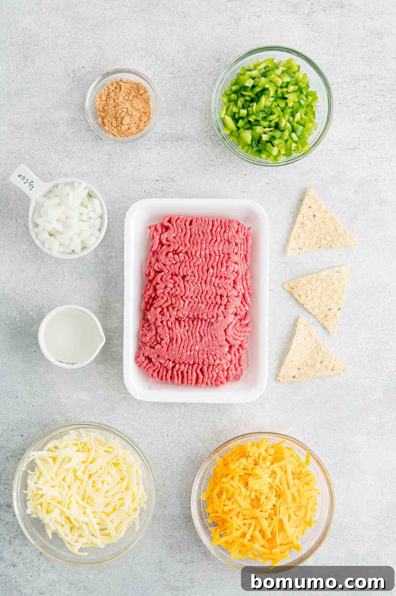 The ingredients for ground beef nachos.