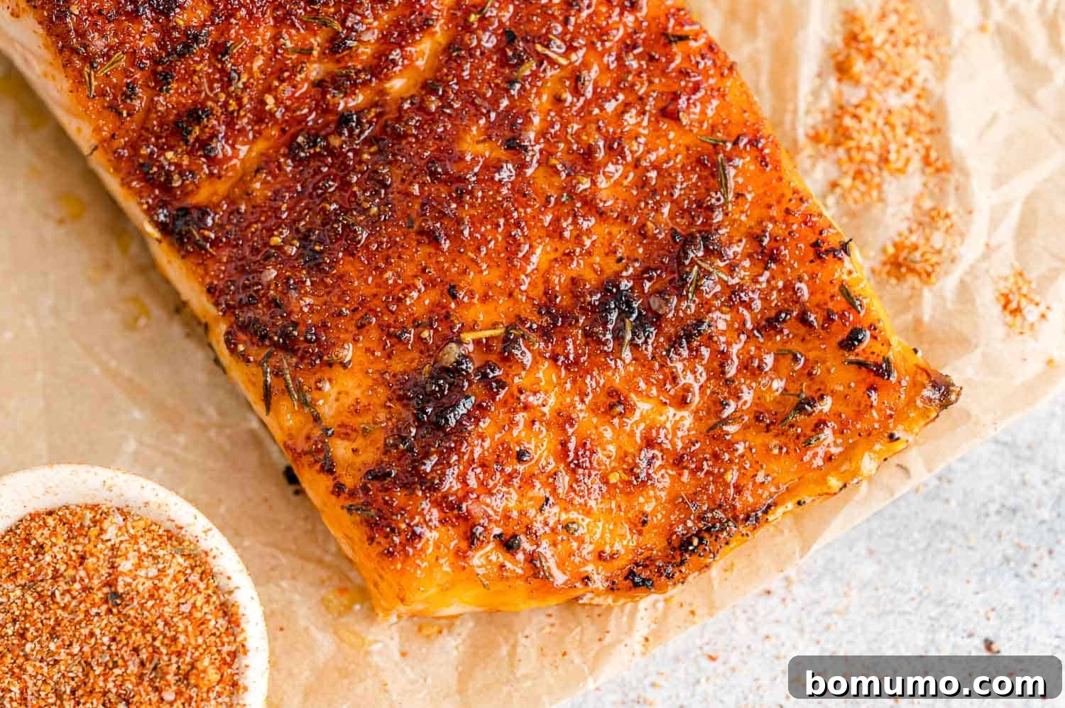 A beautifully cooked salmon fillet, golden brown and perfectly seasoned with the homemade rub, ready to be served.