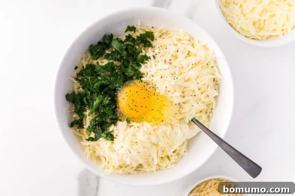 Savory Meat-Filled Jumbo Shells 8 A bowl filled with ricotta cheese, shredded mozzarella and Parmesan, fresh parsley, and a single egg, waiting to be mixed into the creamy filling.