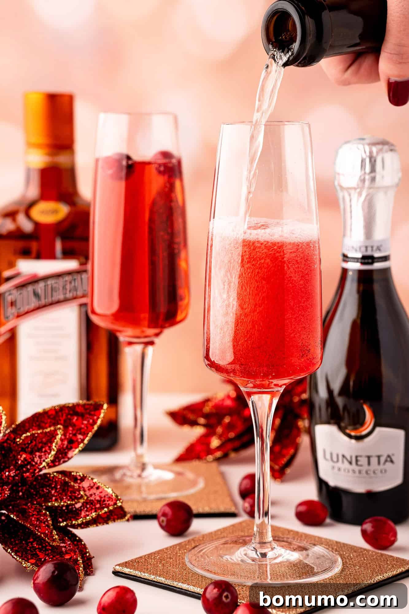 Topping off the cocktail with Prosecco.