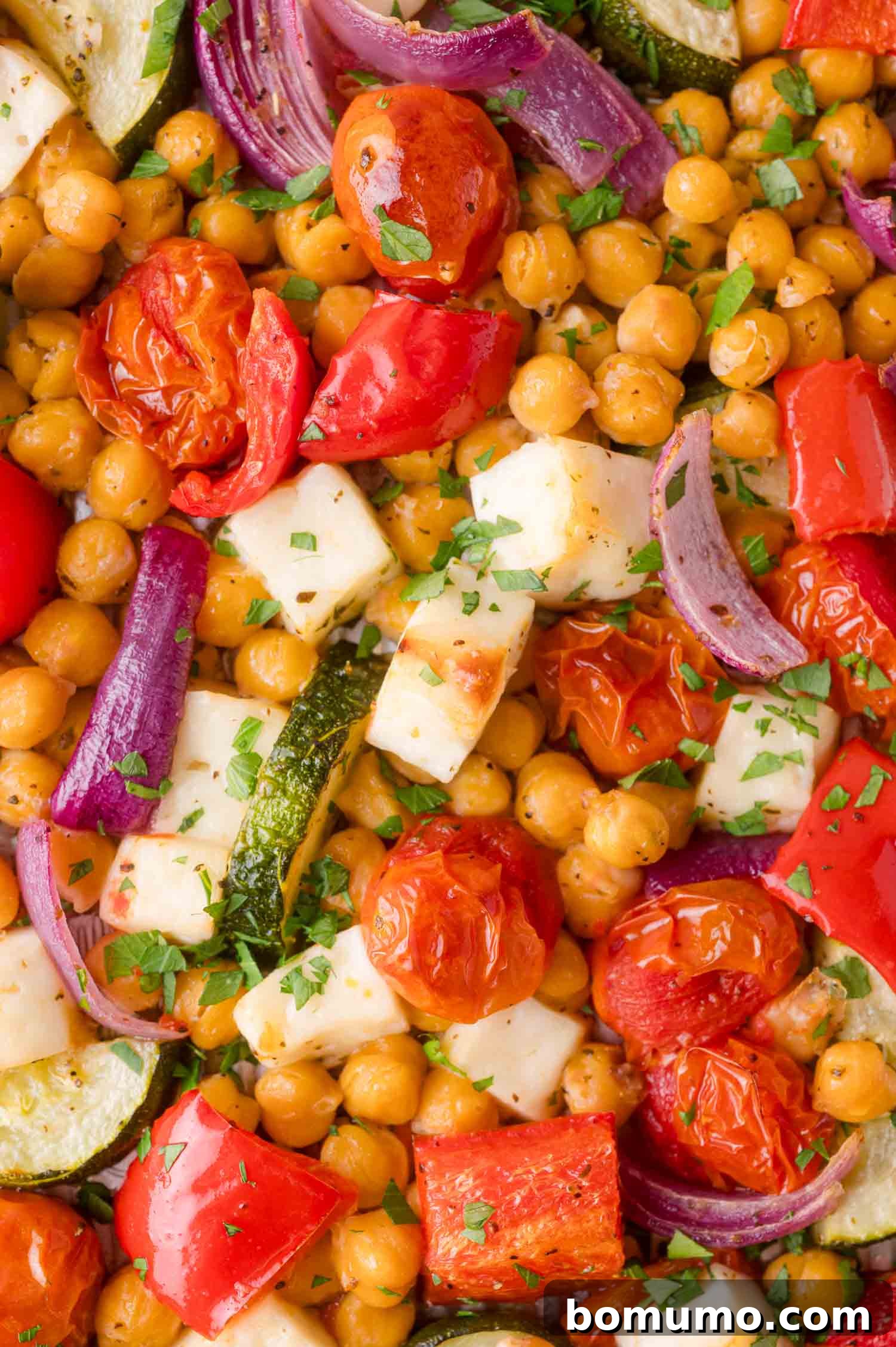 Close-up of the finished Mediterranean Chickpea and Halloumi Sheet Pan Dinner.