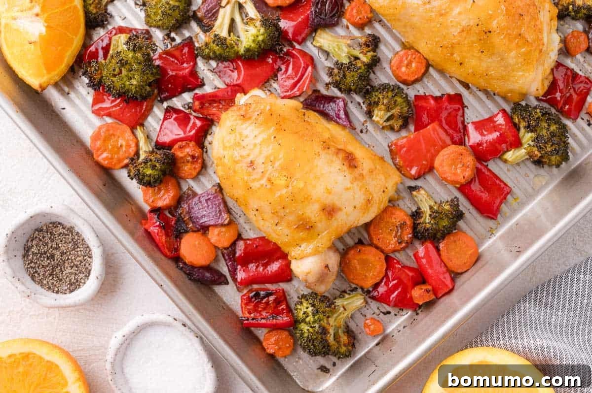 Sheet Pan Citrus Chicken and Rainbow Vegetables plated and ready to serve.