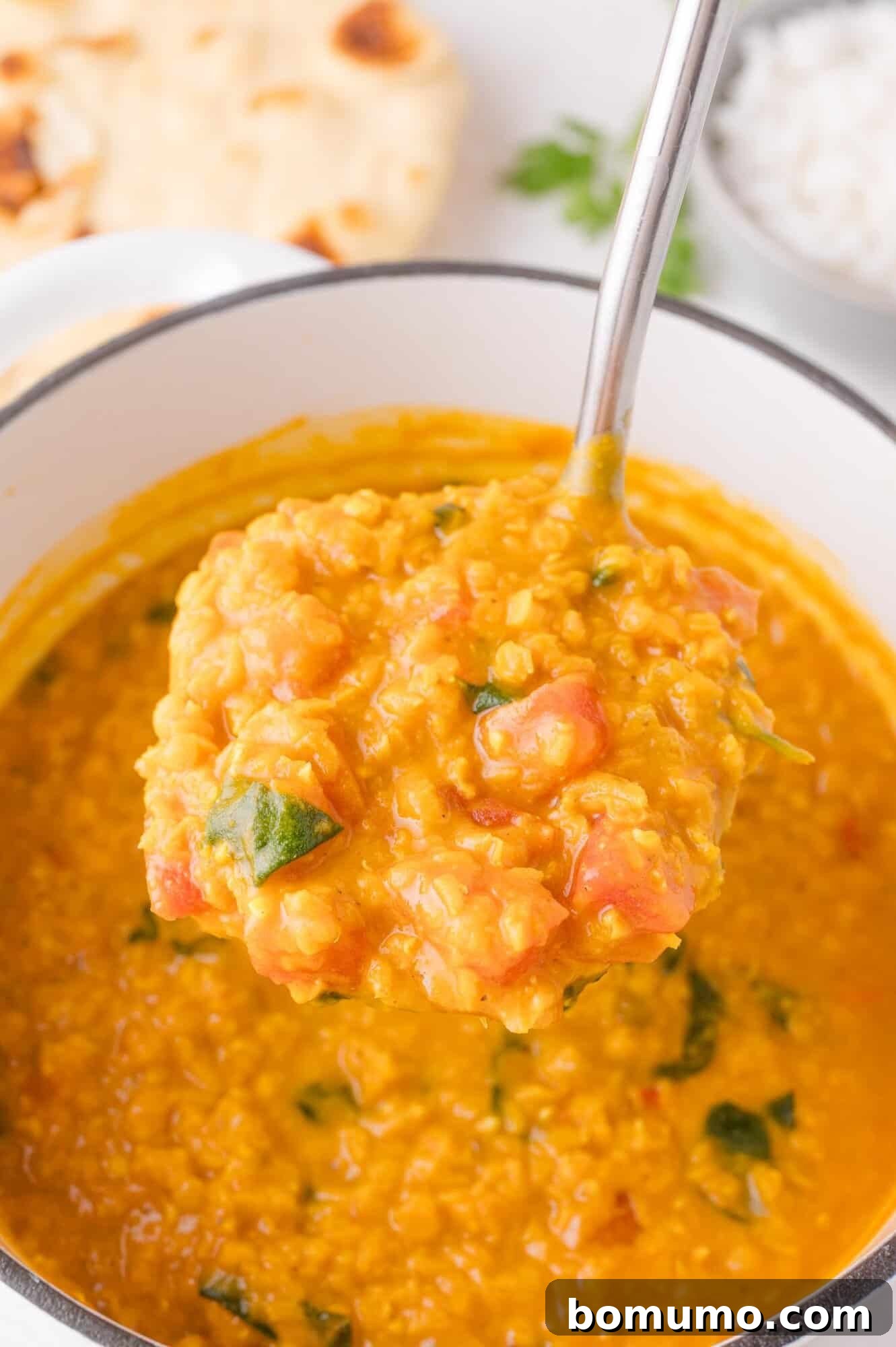 Serving red lentil curry