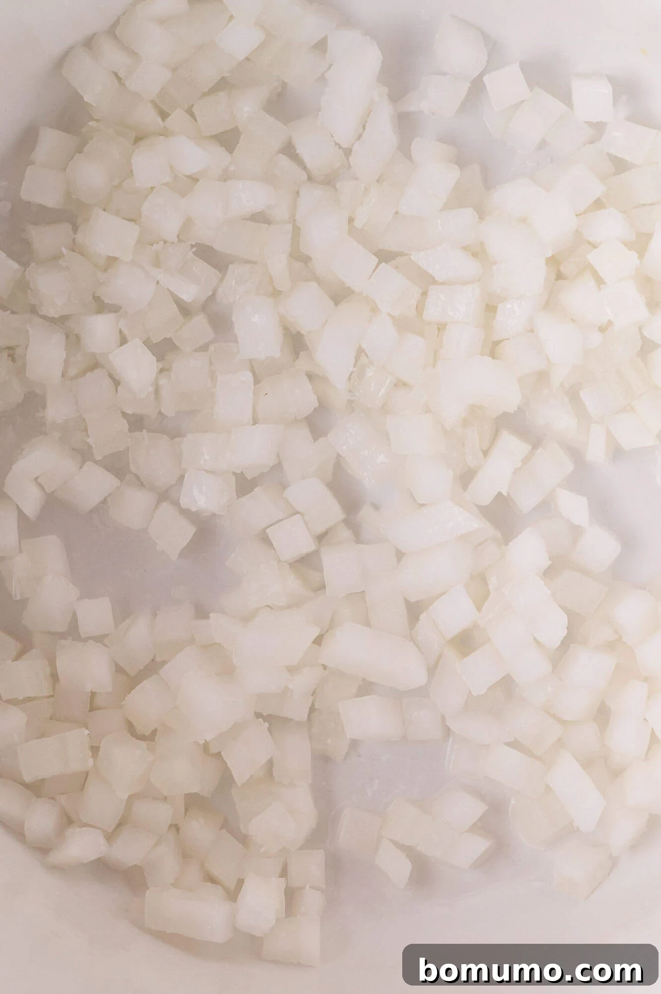 Cooking onions for red lentil curry