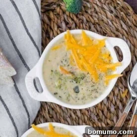 Image of pressure cooker broccoli cheddar soup in white bowls.