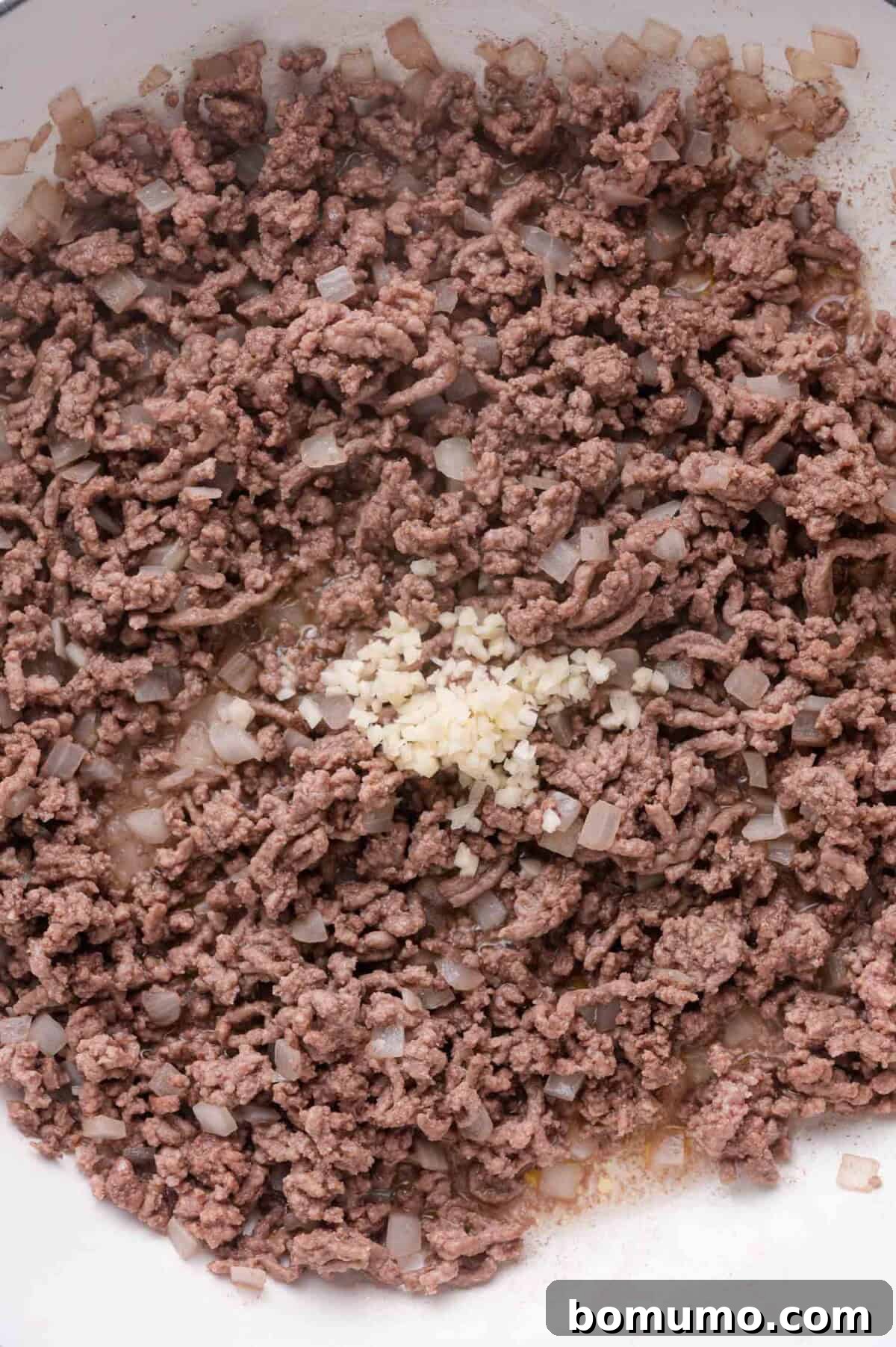 Adding Garlic to Beef and Onions