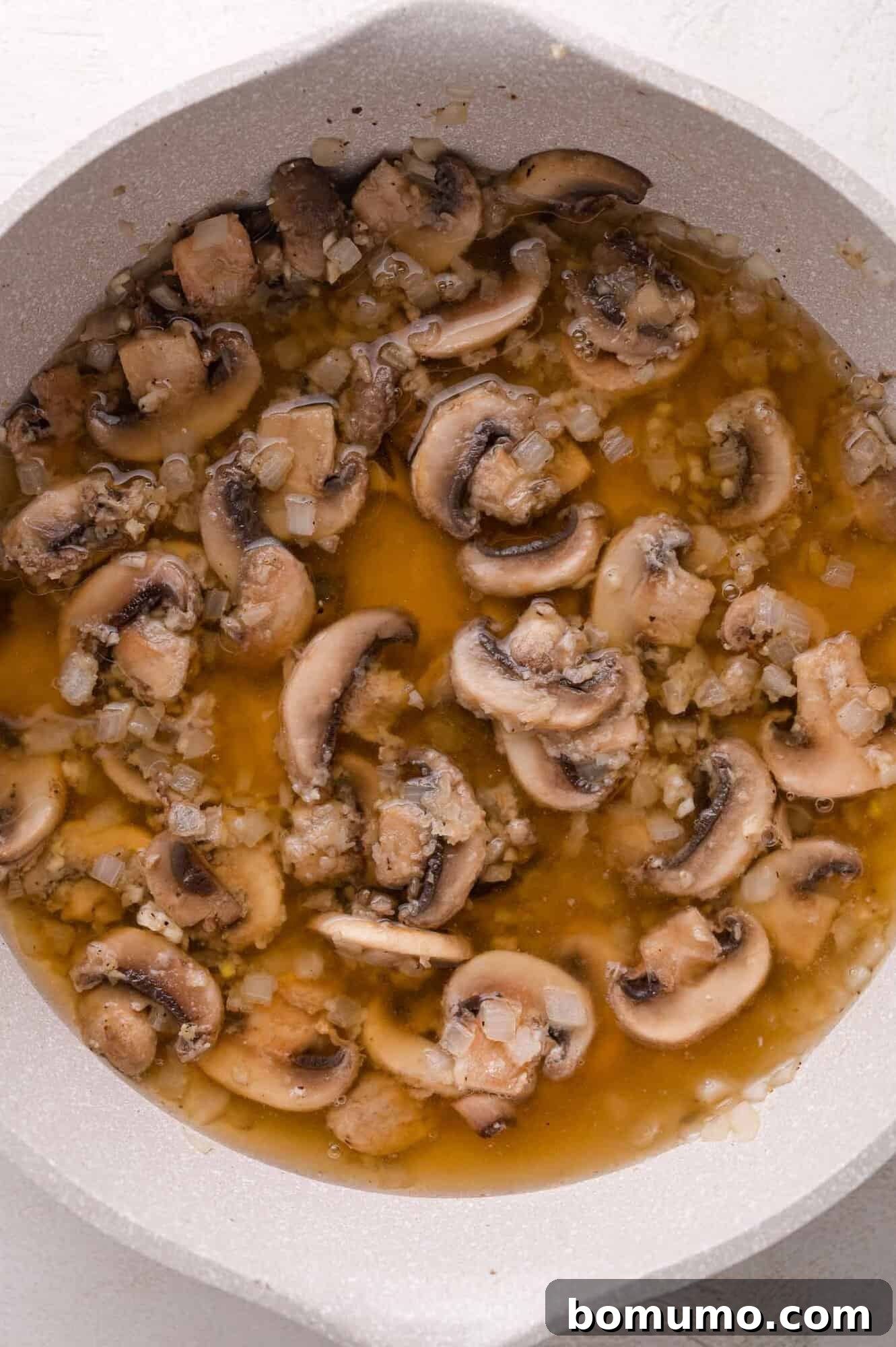 Adding broth