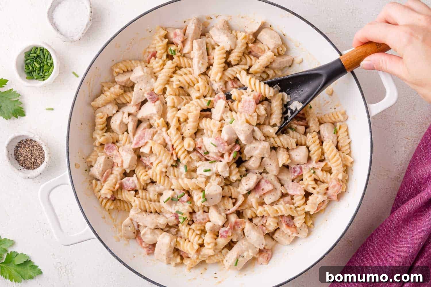 Chicken Bacon Ranch Pasta being stirred in a pan