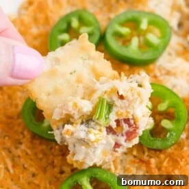 Hot and flavorful Jalapeño Popper Dip on a cracker.