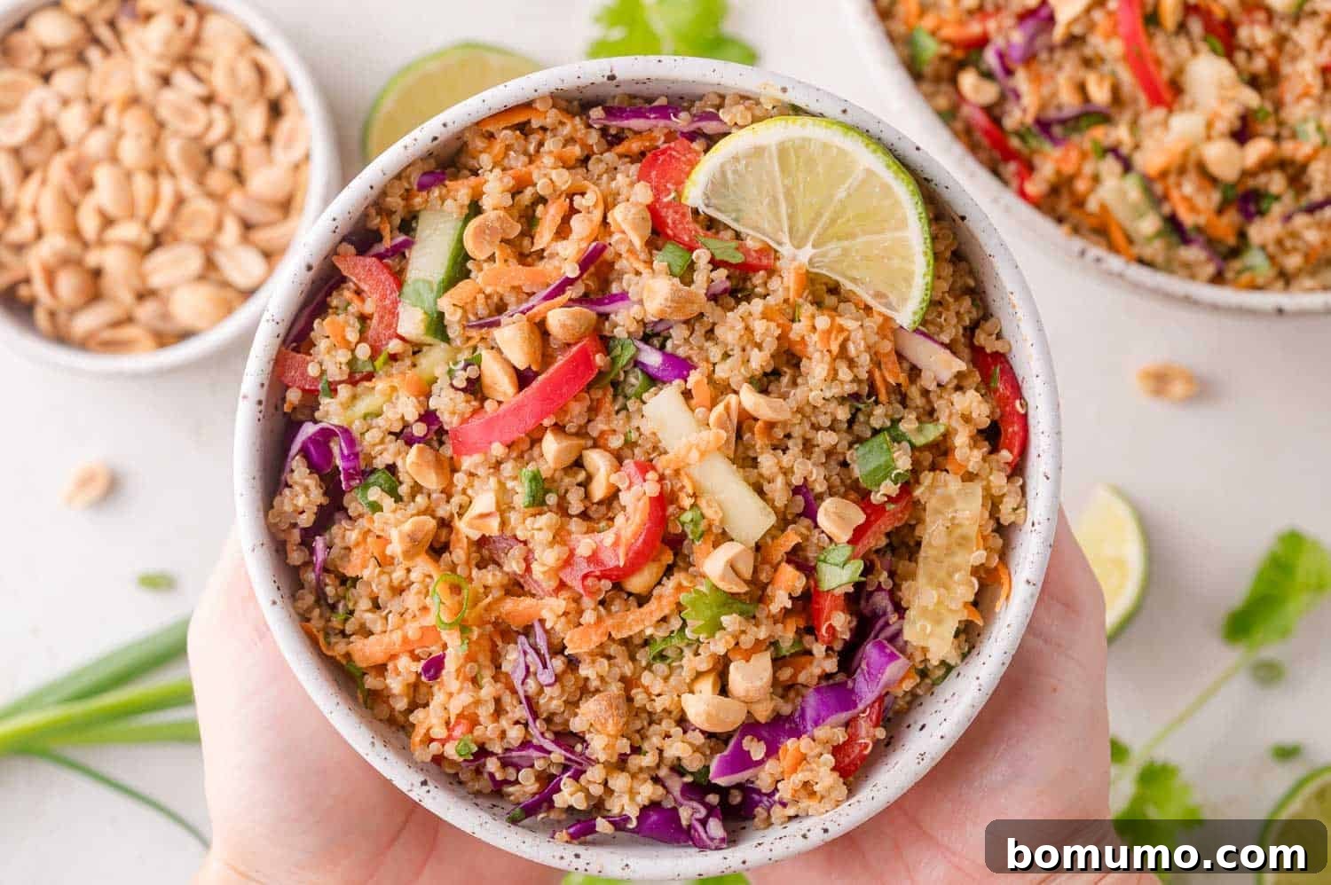 Serving Quinoa Spring Roll Salad with a lime wedge