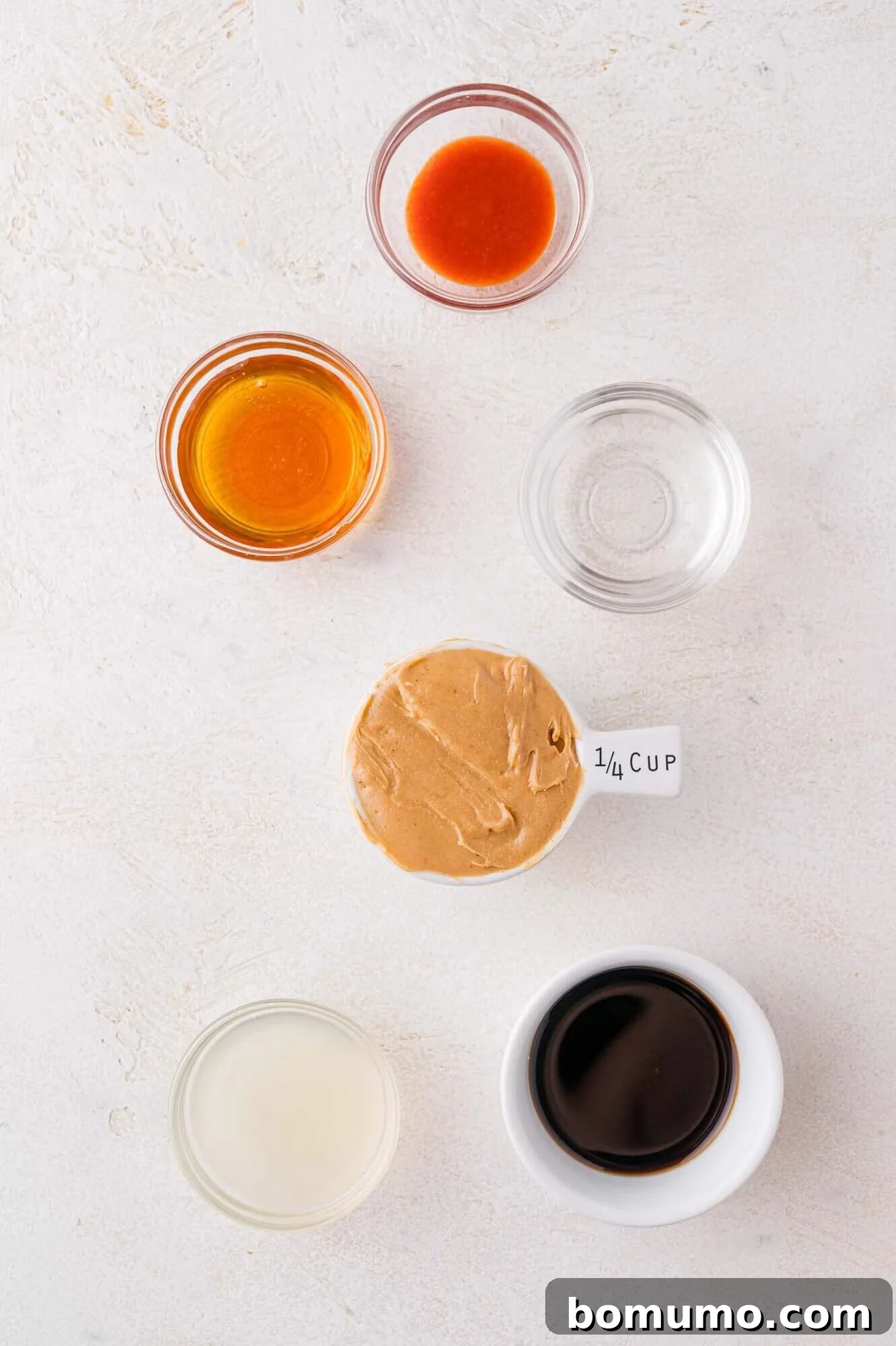 Ingredients for the peanut dressing: sriracha, honey, water, peanut butter, lime juice, and soy sauce