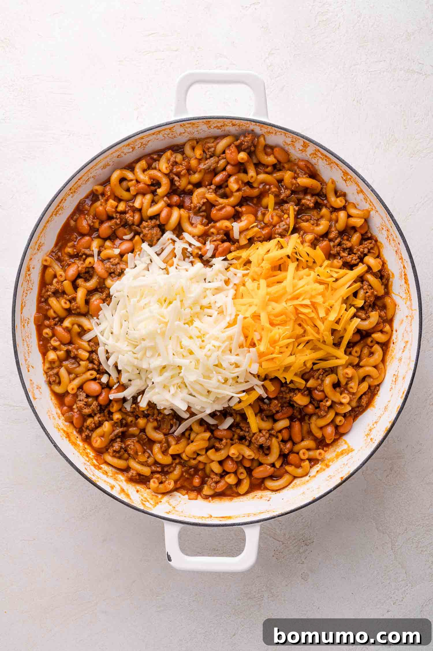 Topped with shredded cheese.