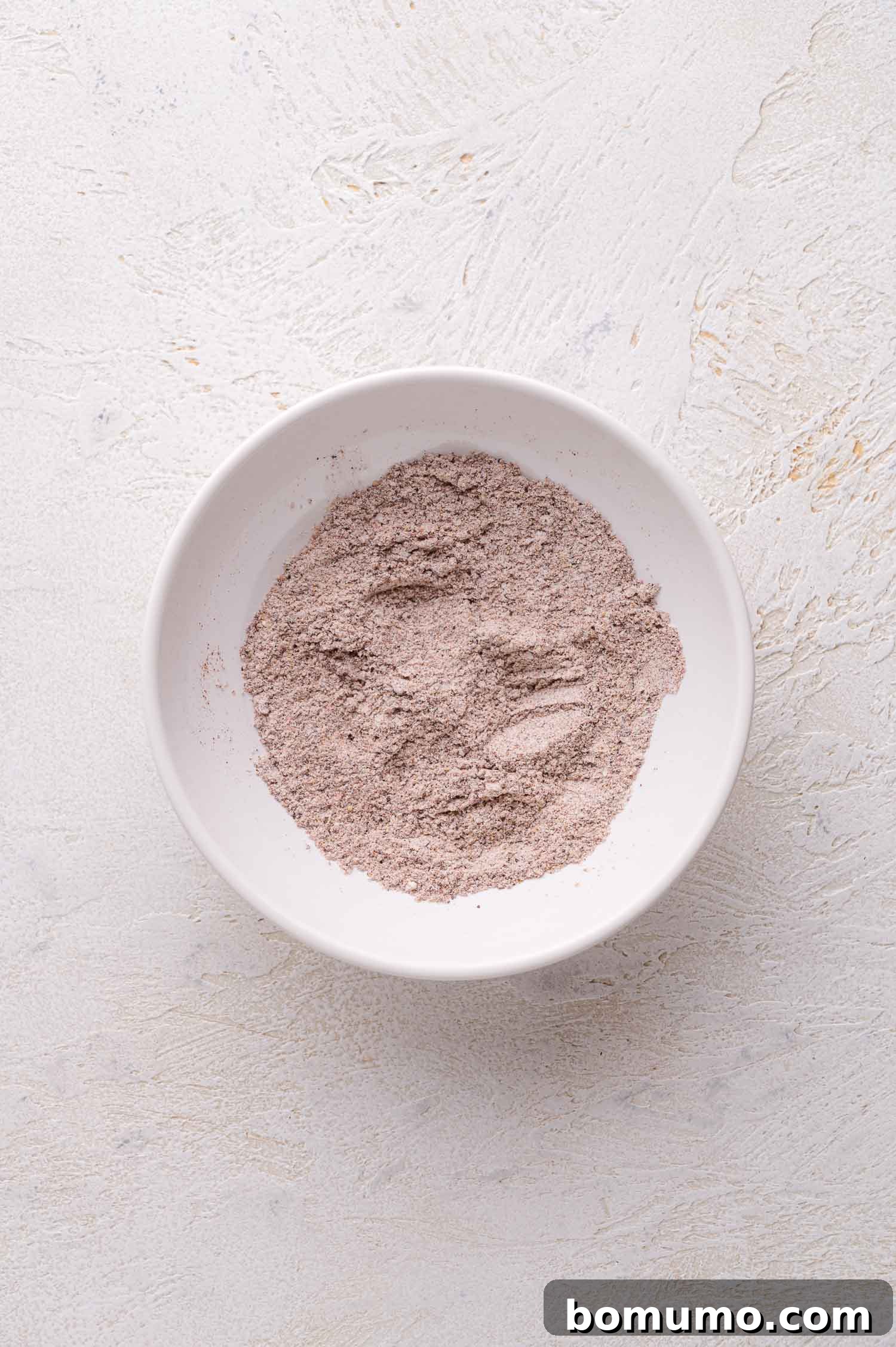Flour and spices in a bowl.