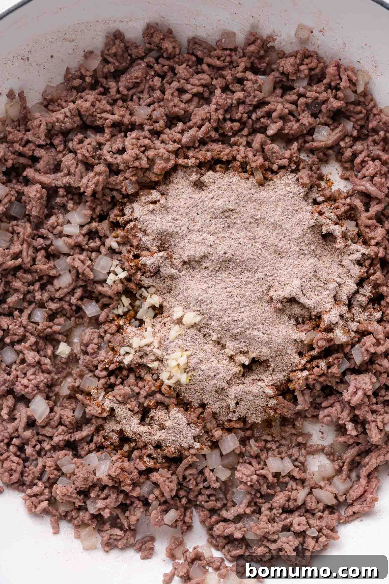 Seasoning mix added to beef and onions.