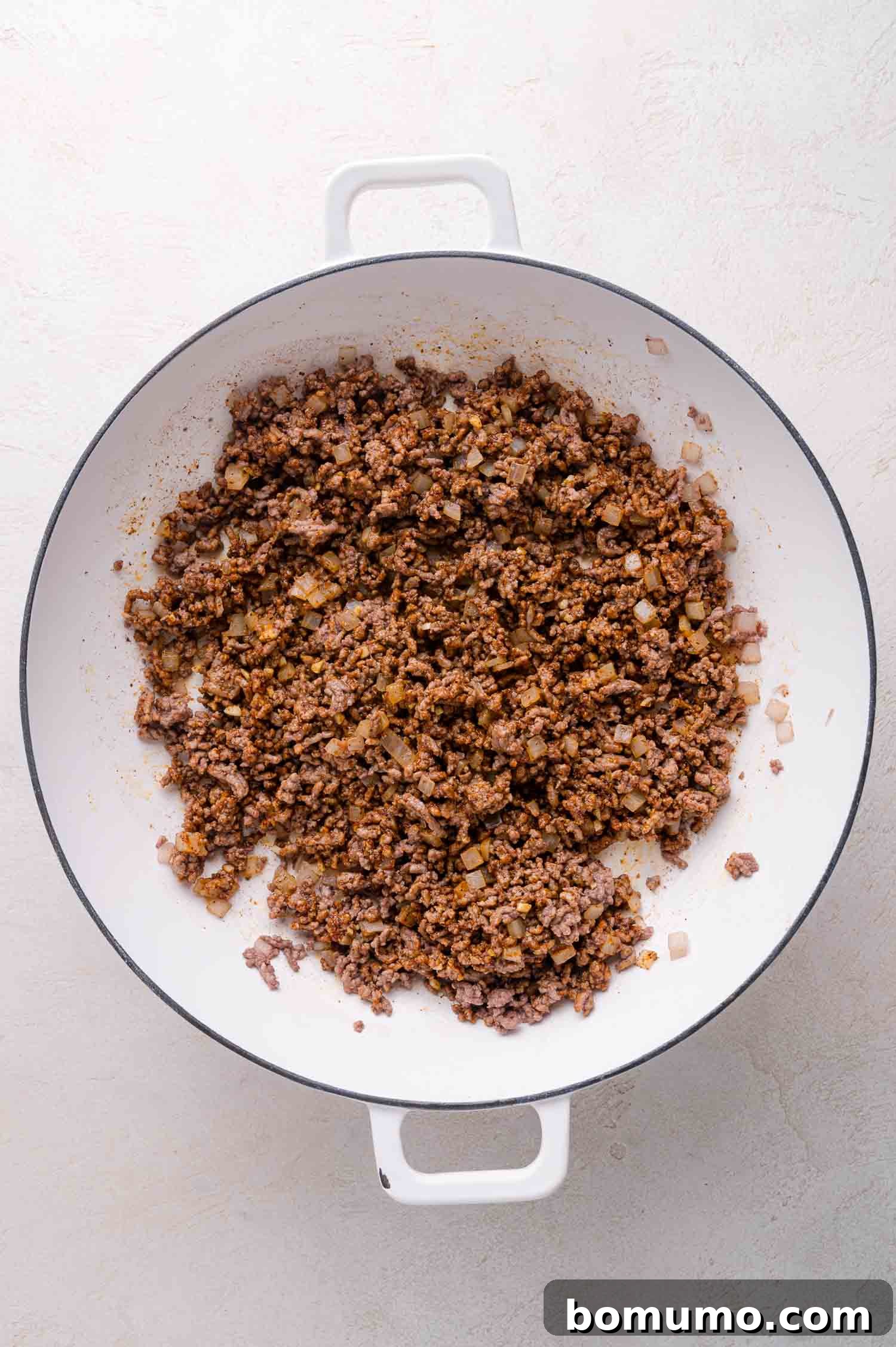 Cooked beef, onions, and seasoning.