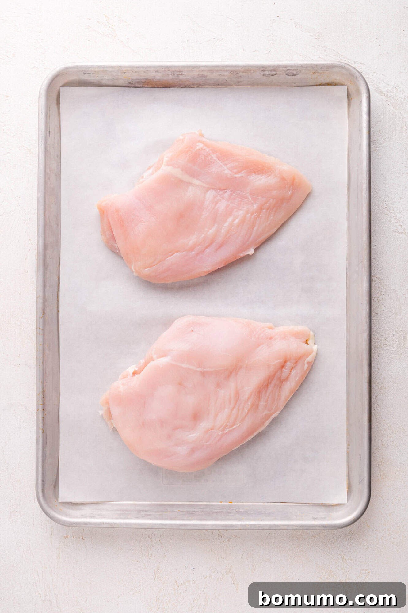 Chicken on baking sheet