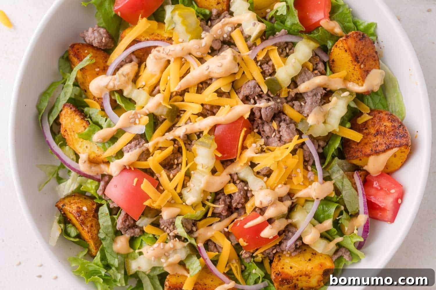Another beautiful burger bowl with a creamy drizzle.