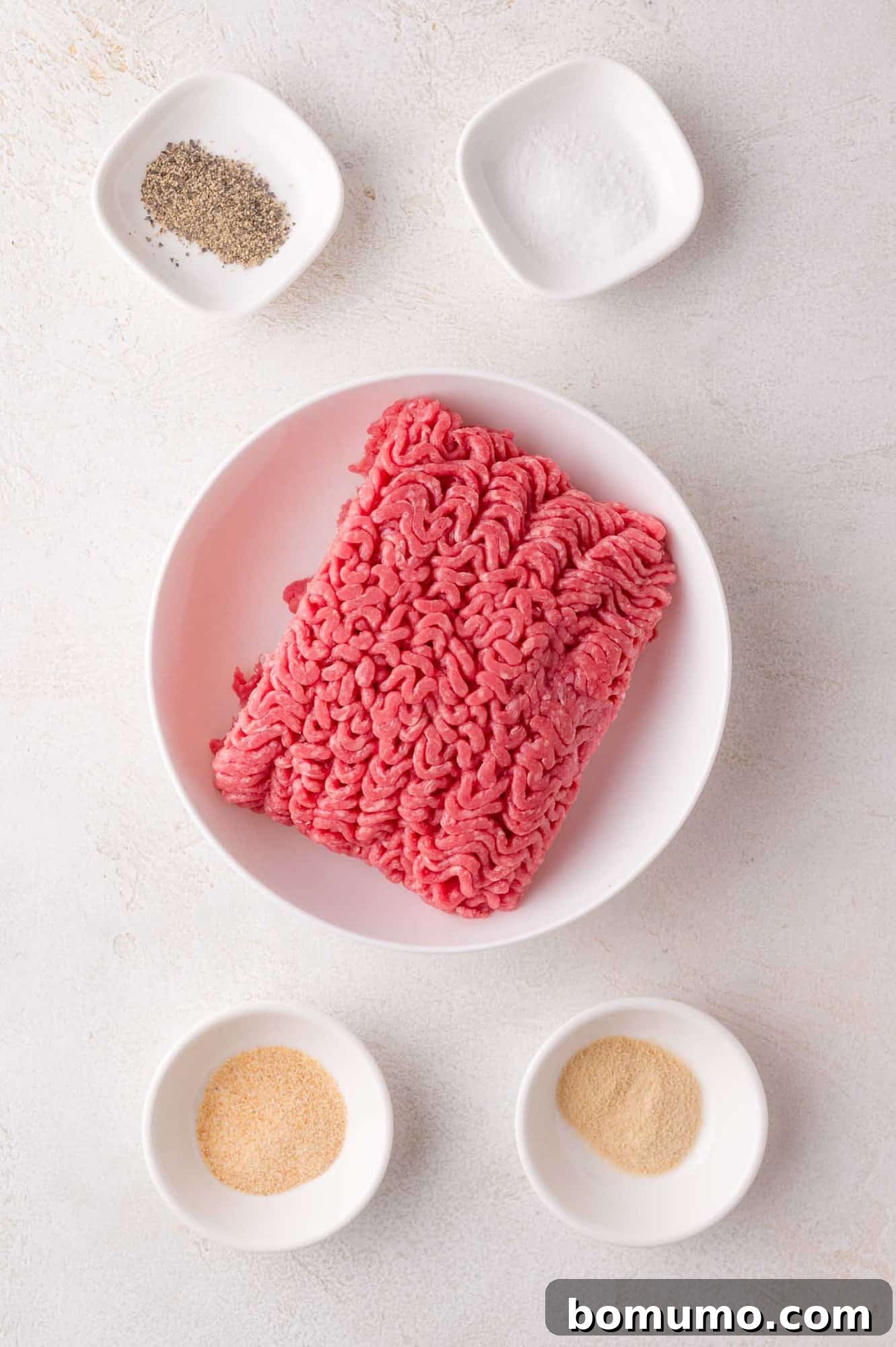 Ground beef and seasonings ready to cook.