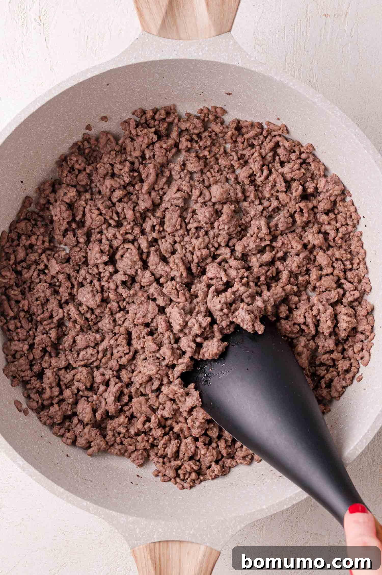 Cooking ground beef in a skillet.