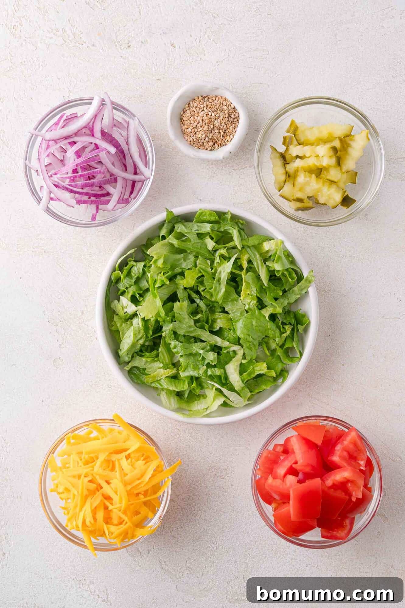 All the toppings for a burger bowl prepped.