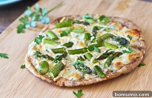 Pita Flatbreads with Asparagus and Creamy Cottage Cheese Sauce - Get the easy and delicious summertime recipe on RachelCooks.com!