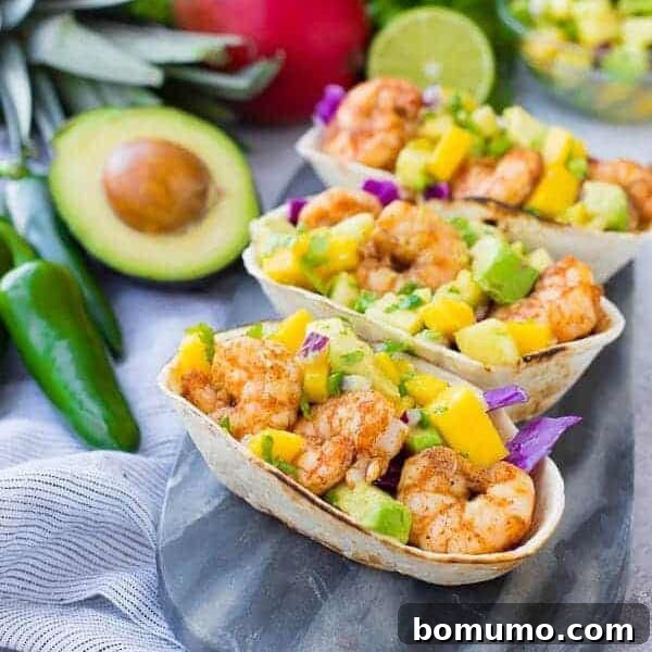 These Shrimp Tacos are a refreshing taste of the tropics thanks the zesty avocado, mango and pineapple salsa.