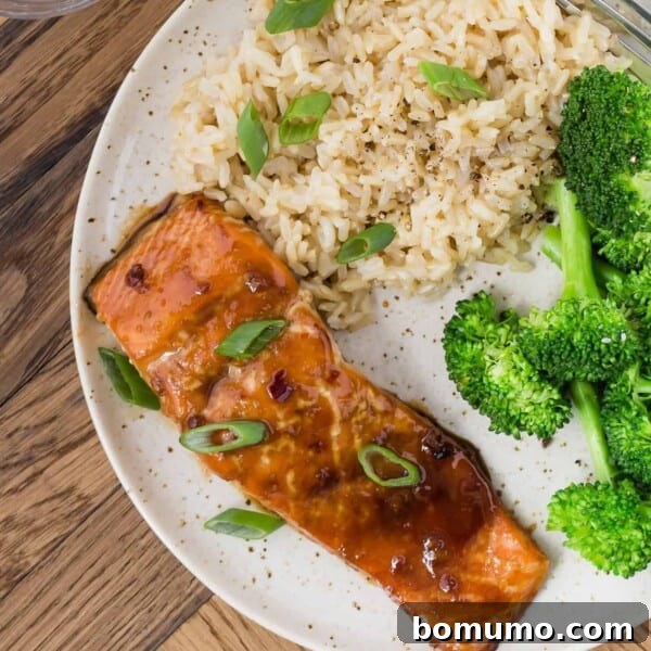 Sheet Pan Caprese Salmon with Tomatoes and Basil 13 Soy glazed salmon on a plate with broccoli and rice.